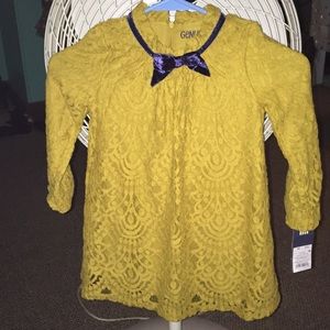 Golden yellow Oshkosh dress for a little girl